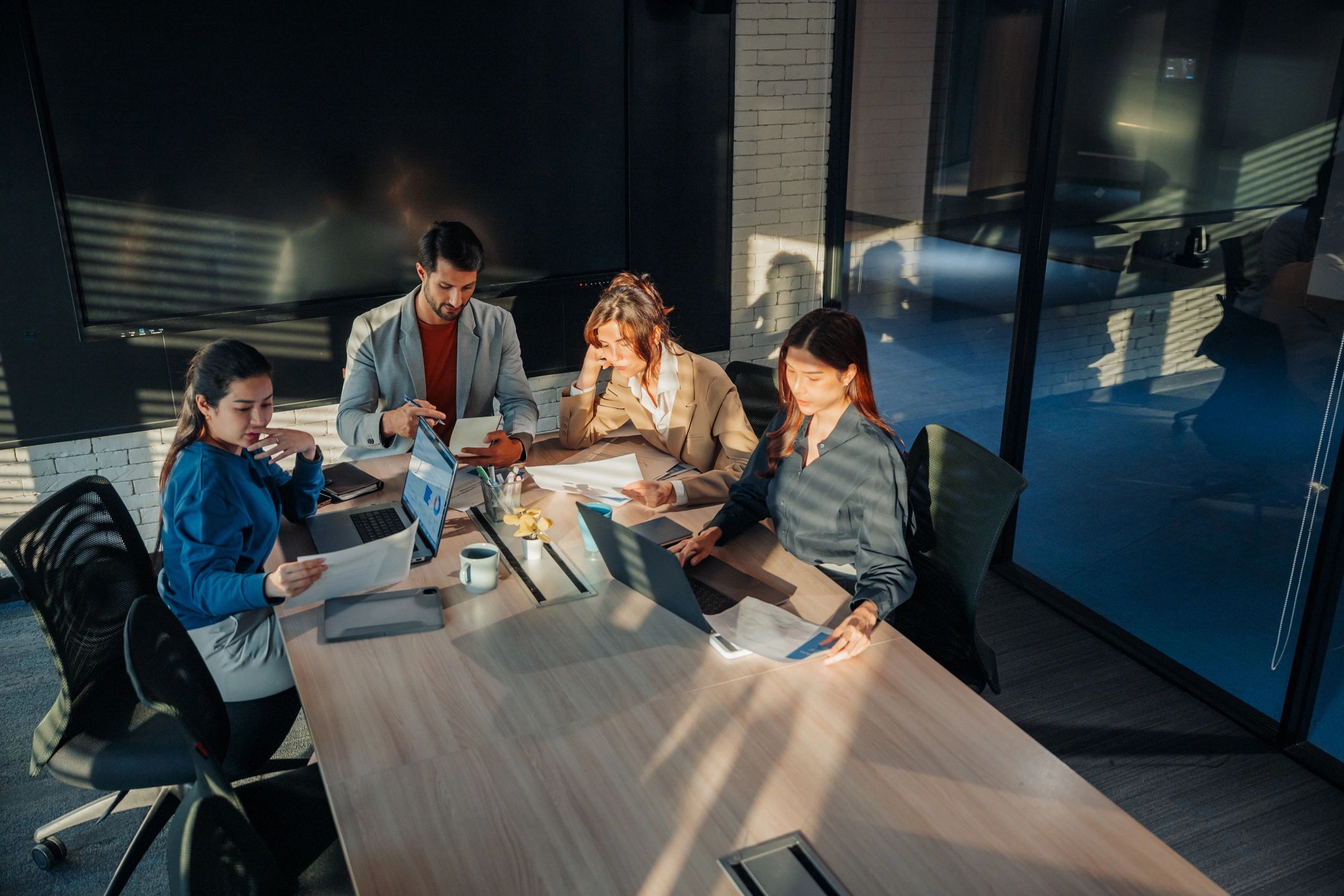 Advisors reviewing financial reports in a boardroom